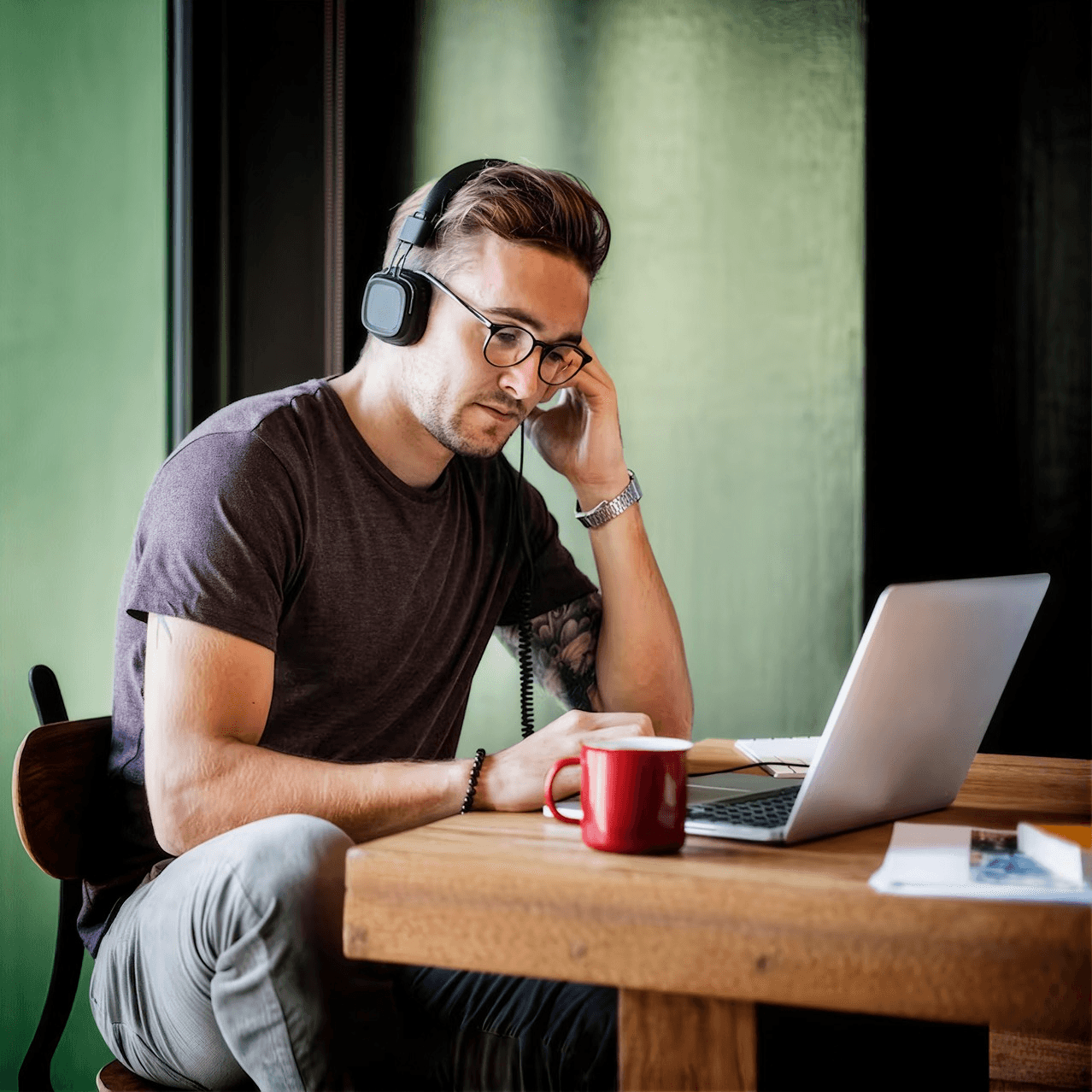 A freelancer reviewing work on a laptop
